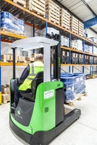 Stacker trucks working in a warehouse